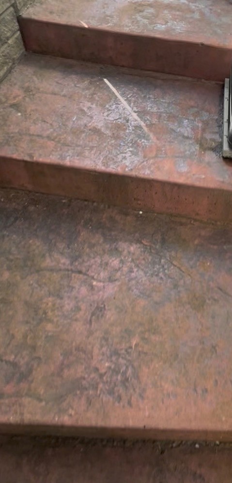 Faded stamped concrete steps before cleaning and sealing